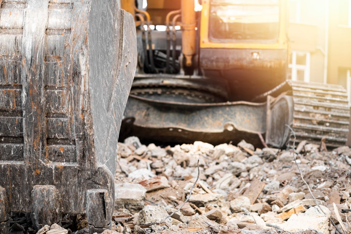 Hydraulic crusher excavator backhoe machinery working on site demolition